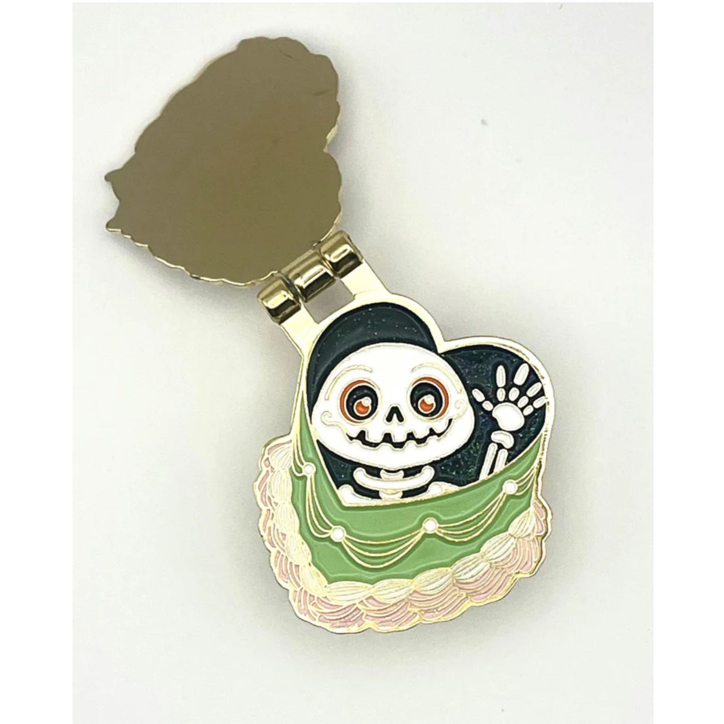 Decorative enamel pin with a skeleton design 