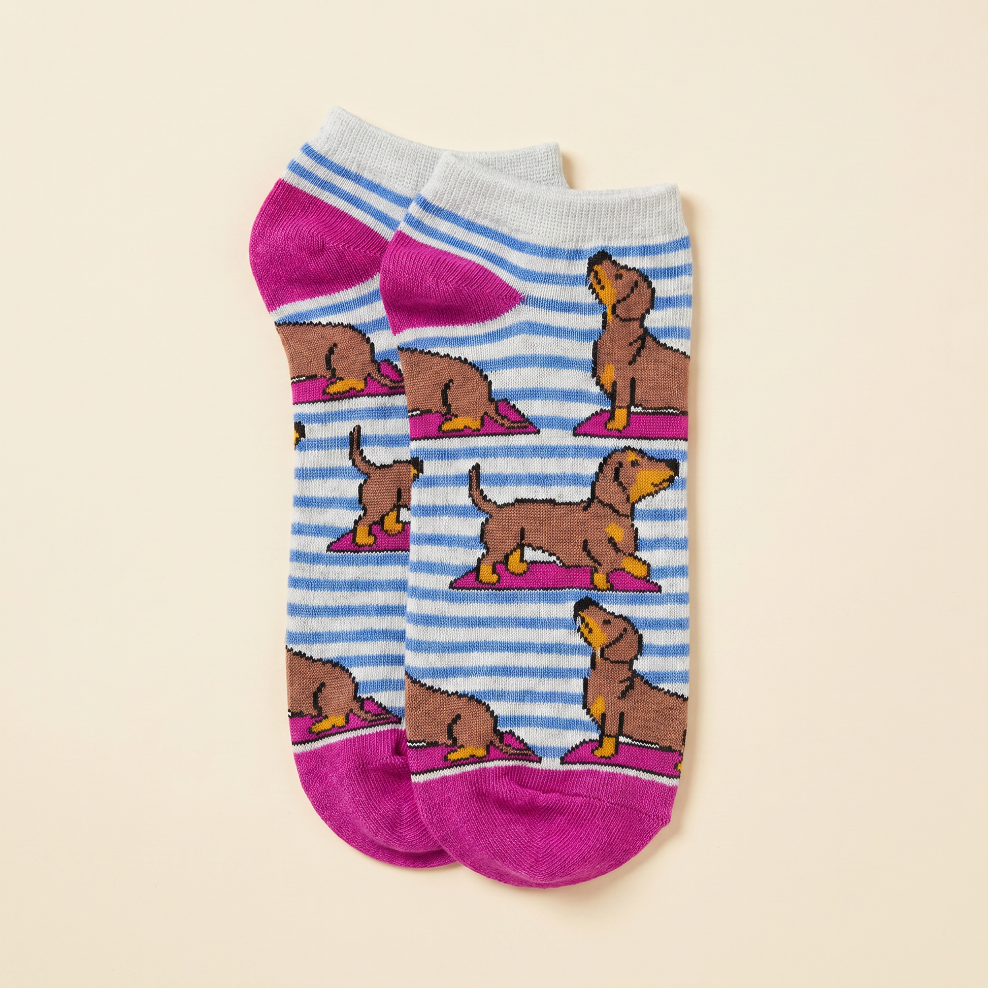 Pair of pink socks with dachshund dog pattern 