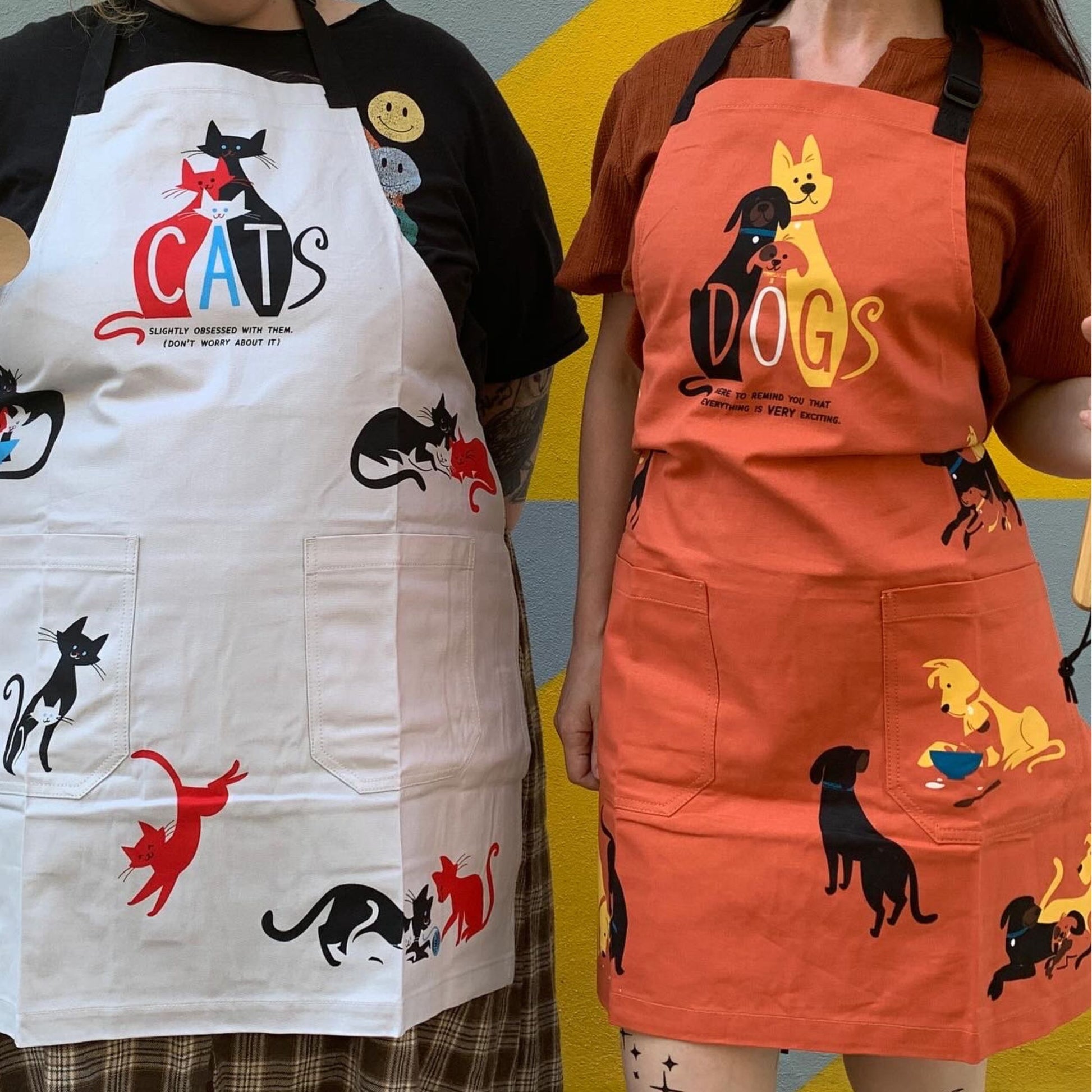 Dogs. Here To Remind You That Everything Is Exciting Funny Cooking and BBQ Apron Unisex 2 Pockets Adjustable Strap 100% Cotton | BlueQ at GetBullish