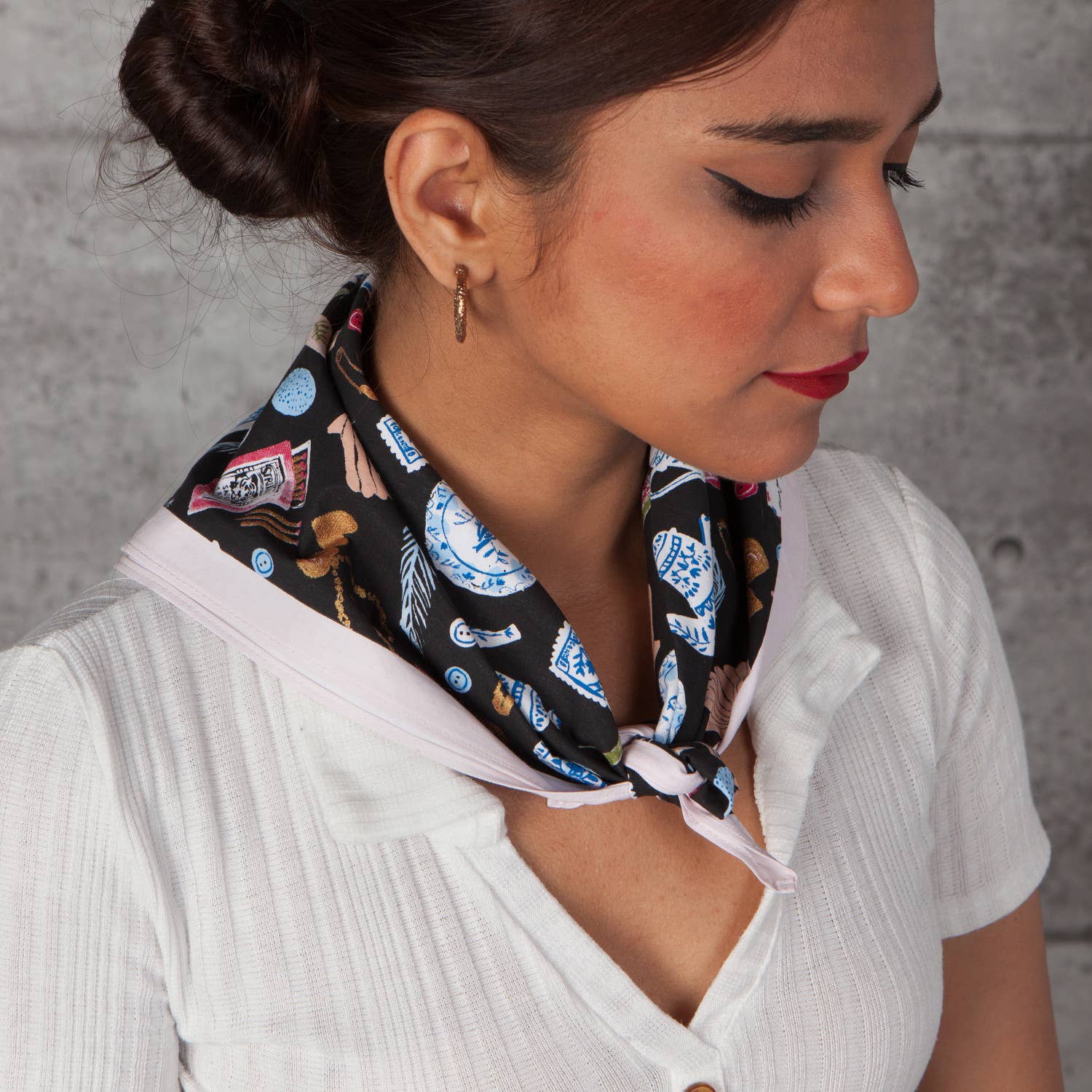 Woman wearing a patterned scarf around her neck