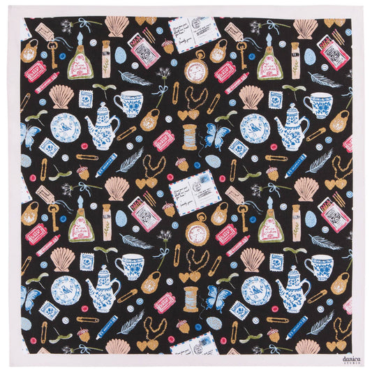Patterned bandana with various objects on a black background