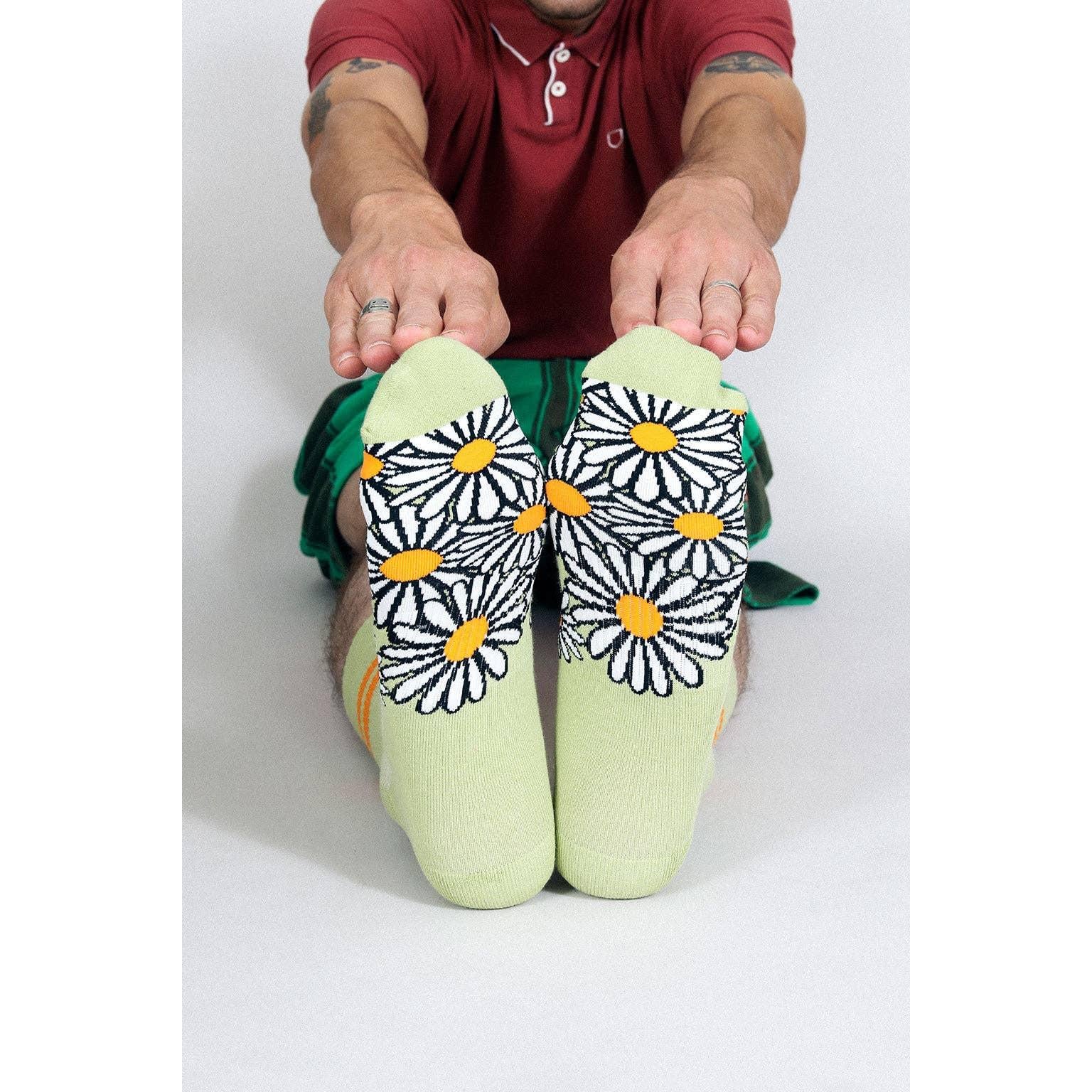 Person wearing socks with floral patterns 