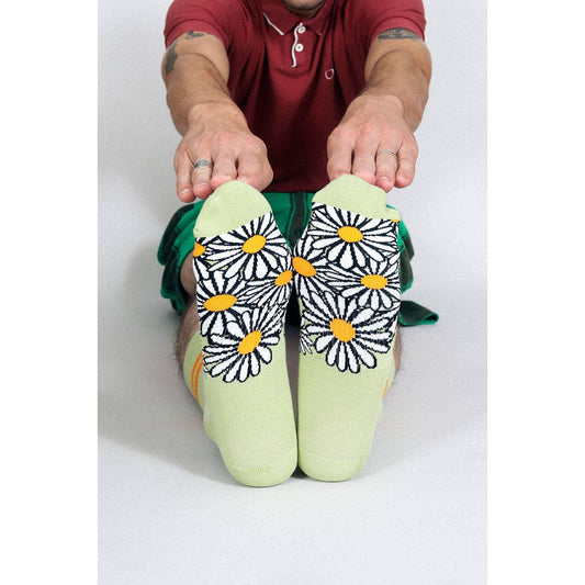 Person wearing socks with floral patterns 