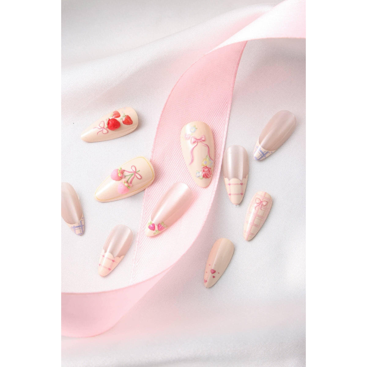 Decorative false nails with floral and heart designs