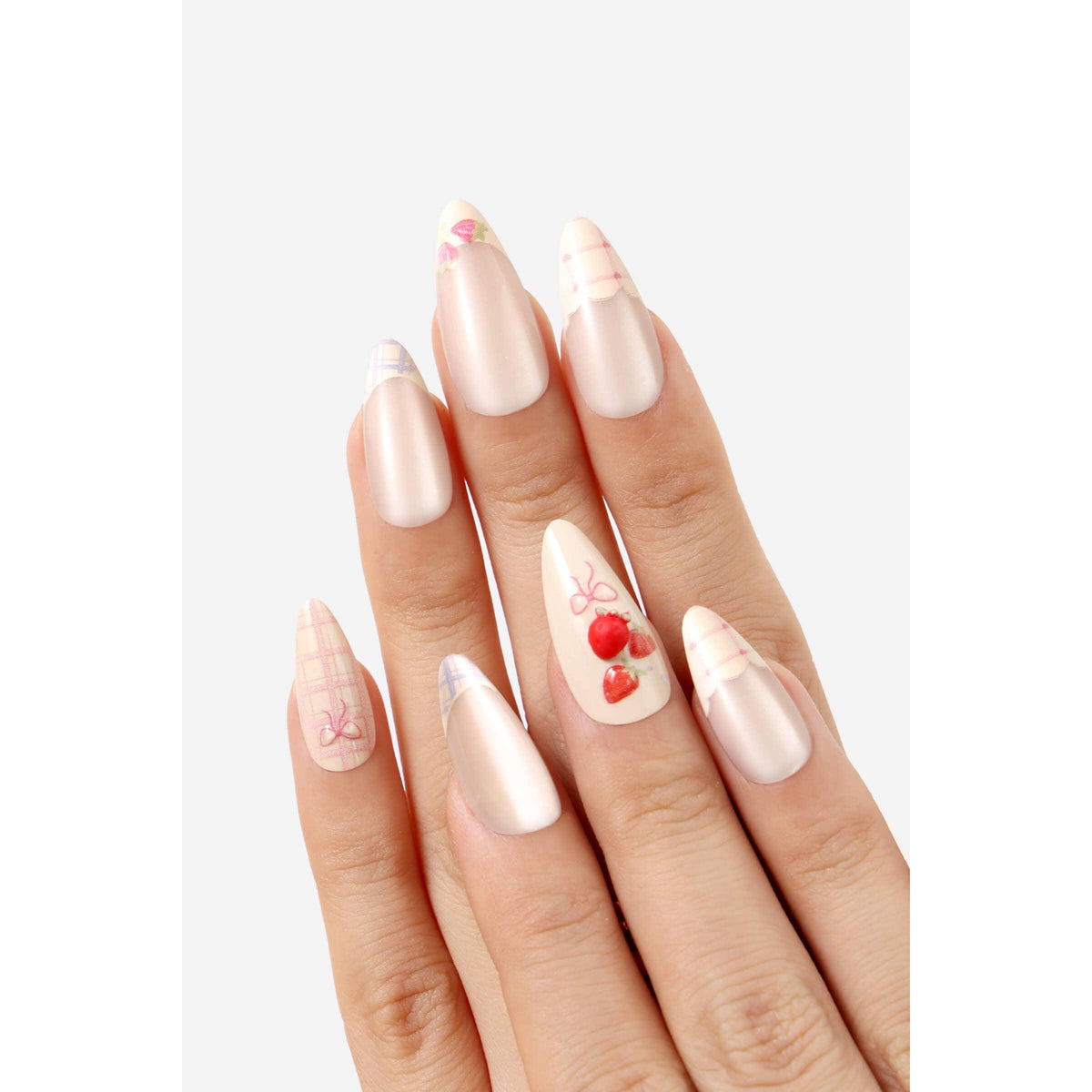 Hand with almond-shaped nails featuring various design