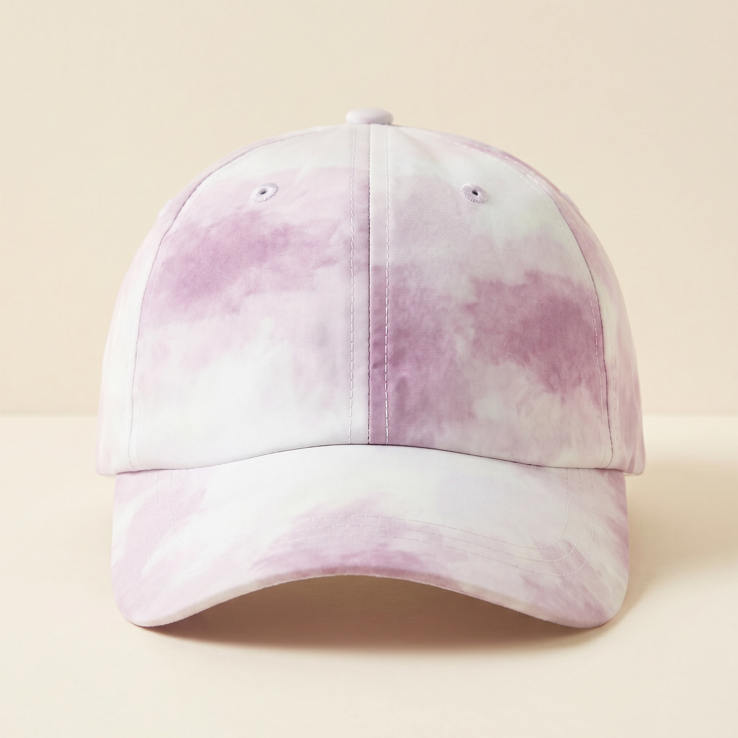 Pink and white tie-dye baseball cap on a beige background