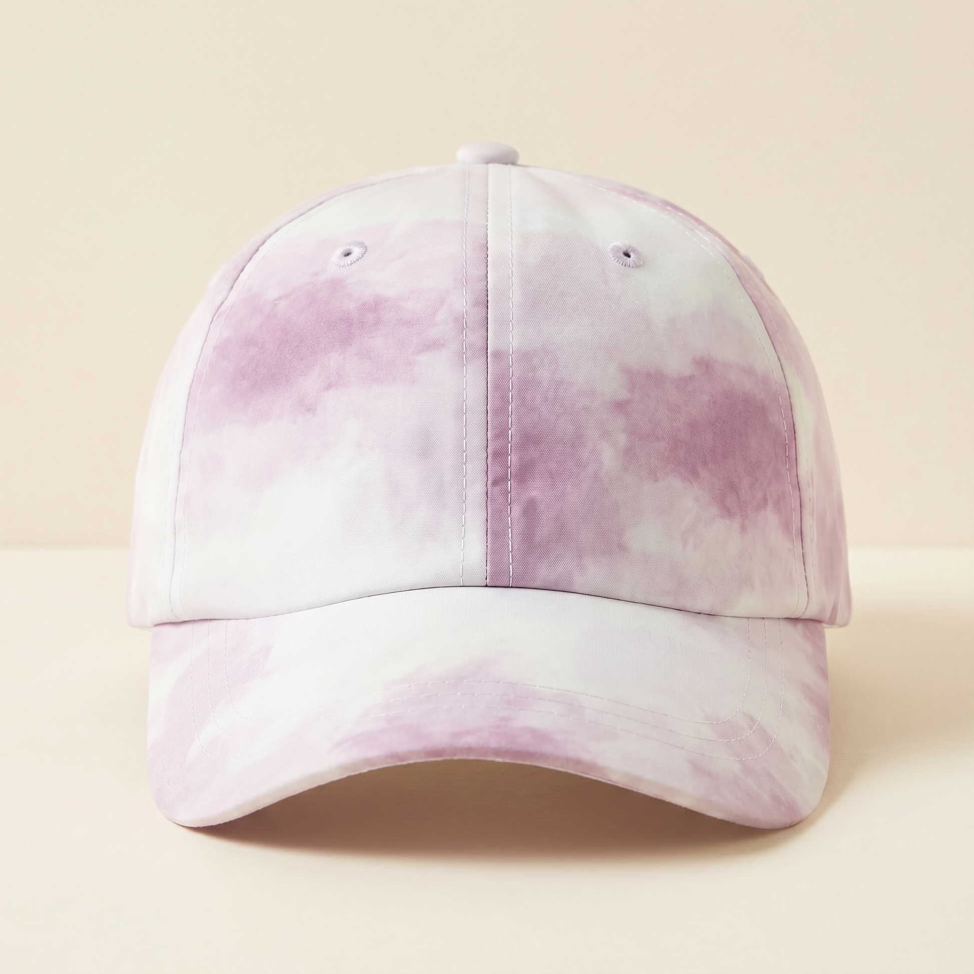 Pink and white tie-dye baseball cap on a beige background