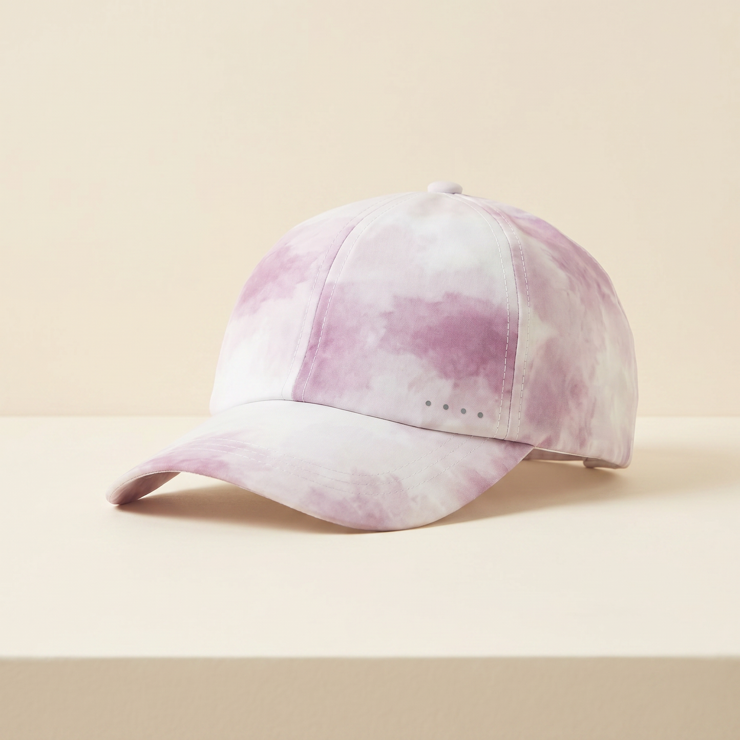 Pink and white tie-dye baseball cap on a beige background