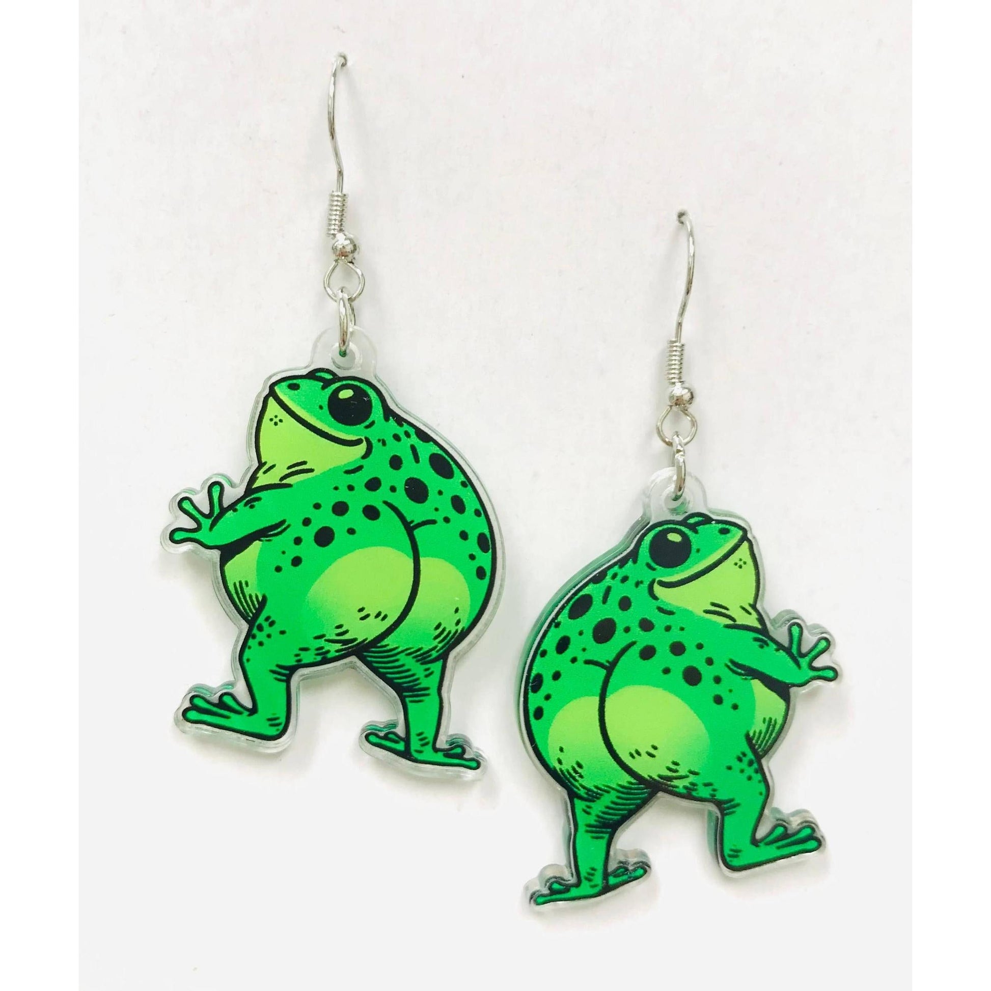 Green frog-shaped earrings showing off their butt