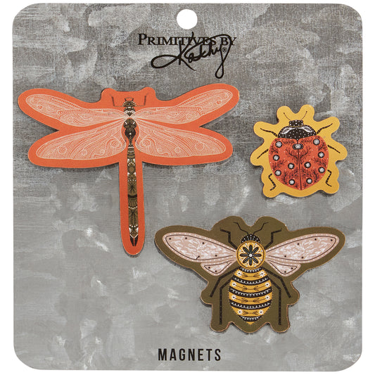Three insect-shaped magnets on a branded card.