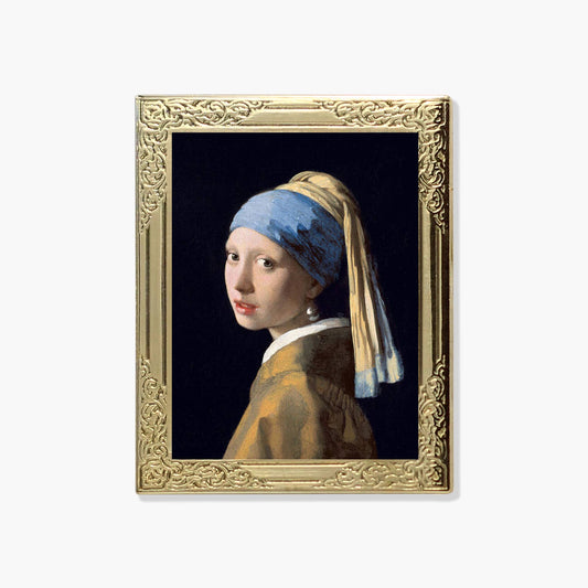 Lapel pin of a framed artwork resembling 'Girl with a Pearl Earring' by Johannes Vermeer 