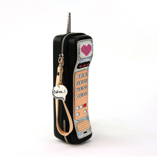 Phone-shaped keychain with decorative elements on a white background
