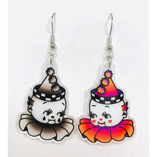 Mismatched pair of earrings with clown character designs - one is a happy clown and another is a sad clown