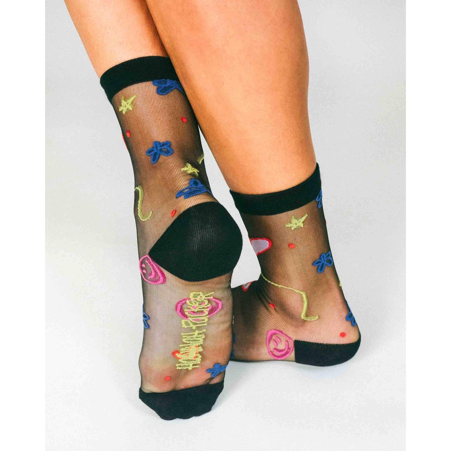 Happy Doodles Sheer Crew Socks by Hannah Packer | Women's Black Lightweight Graphic Socks