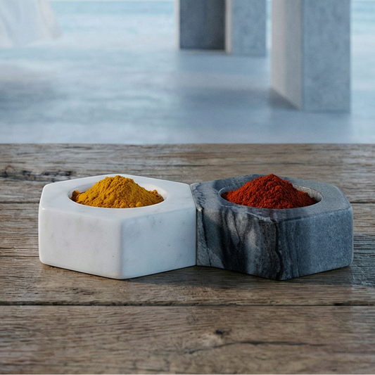 Two small containers with colorful powders on a wooden surface in a modern architectural setting.