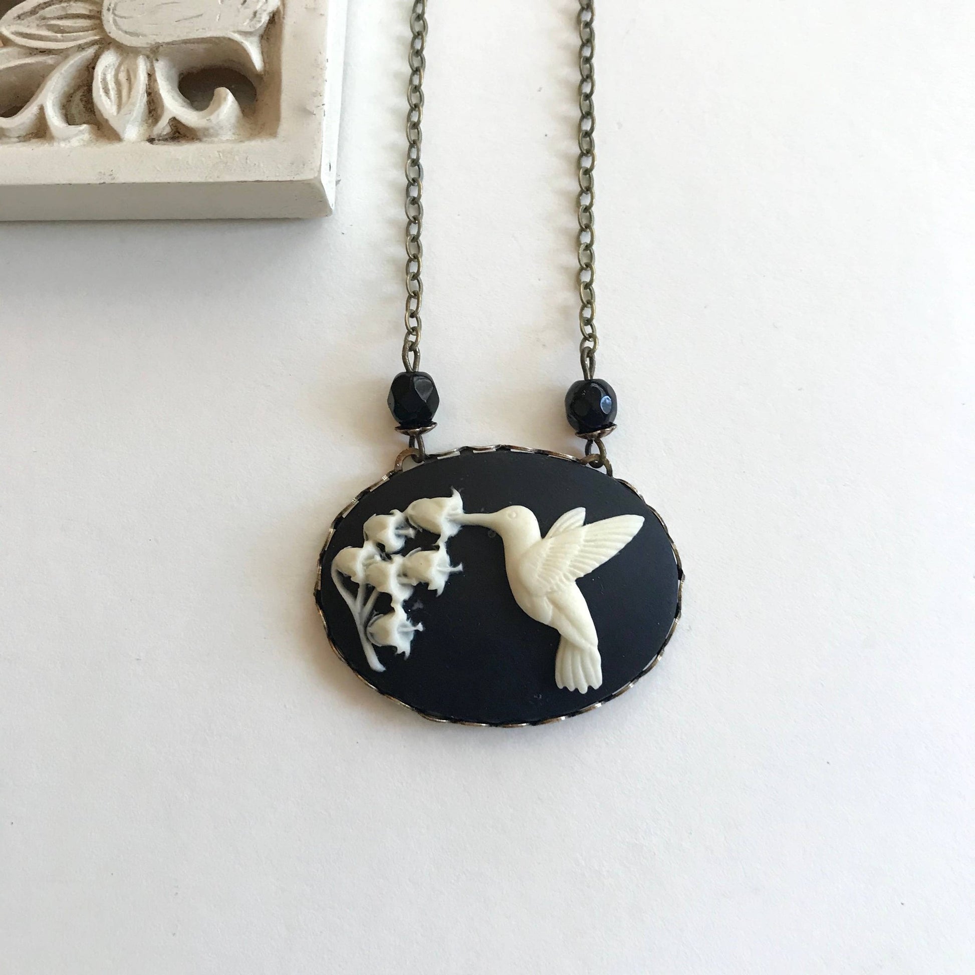 Hummingbird Cameo Necklace in Black and Ivory | Bird Cameo Lily of the Valley Flowers