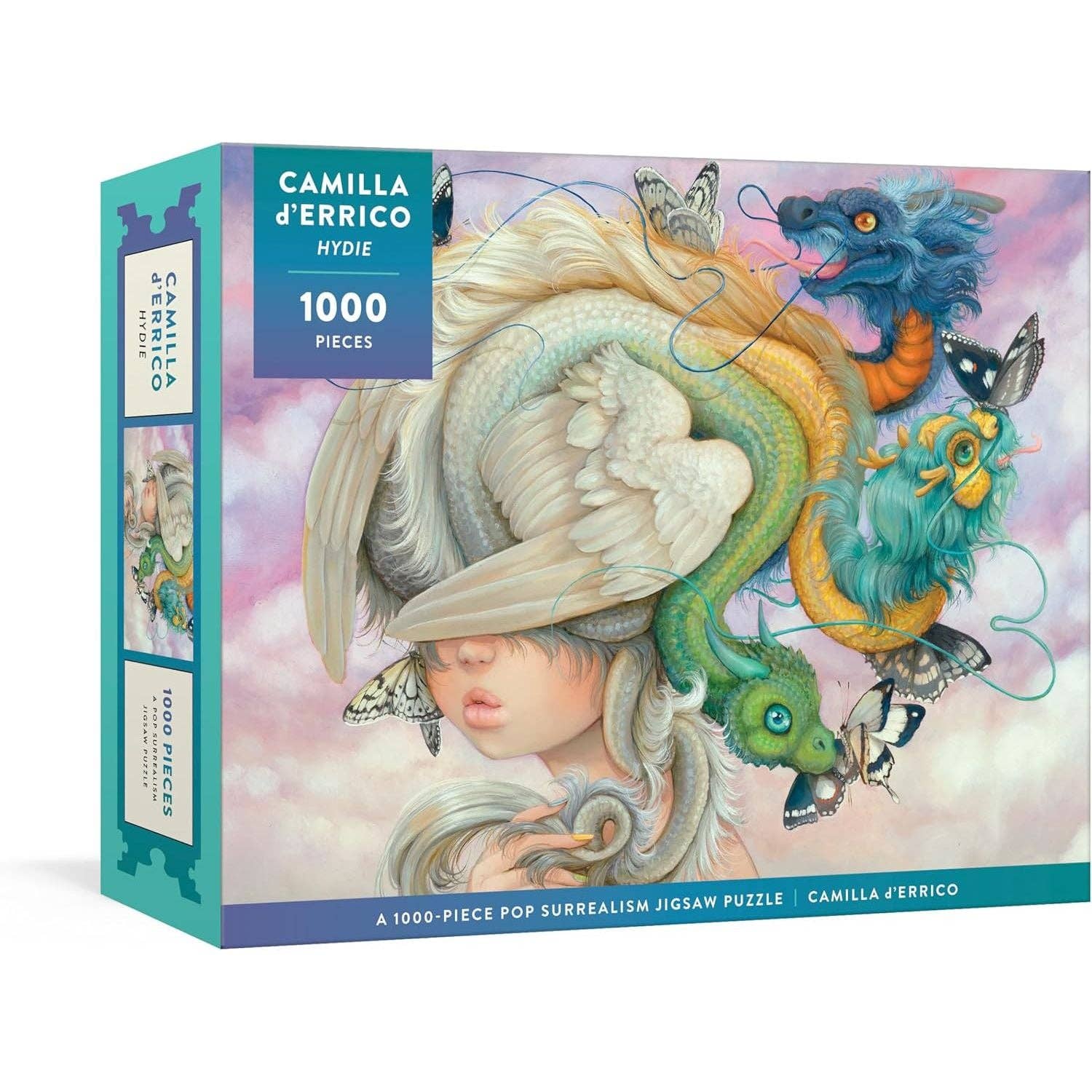 Jigsaw puzzle box with a colorful design featuring a woman's face and fantastical elements, brand 'Camilla d'Errico' visible.