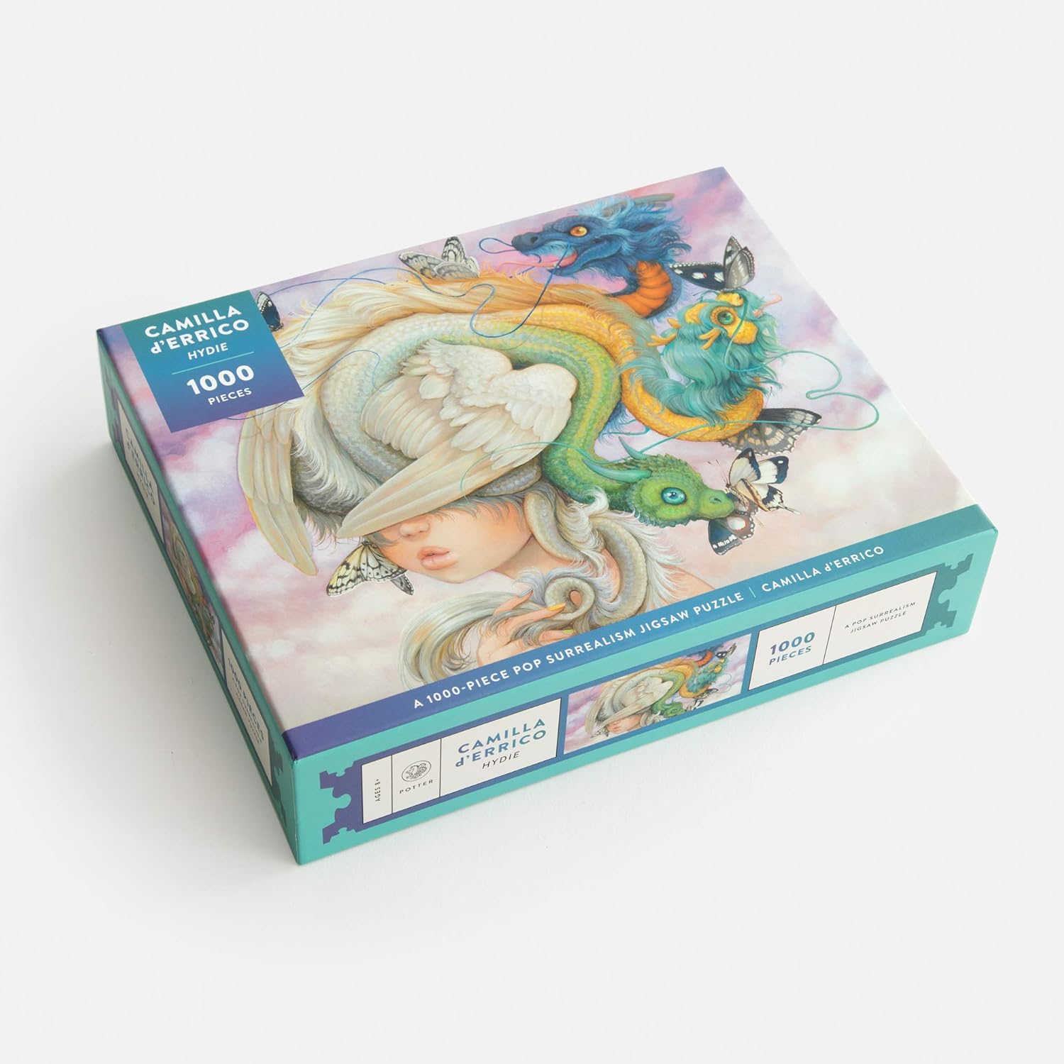 Jigsaw puzzle box with colorful design and 'Camilla d'Errico' branding on a white background