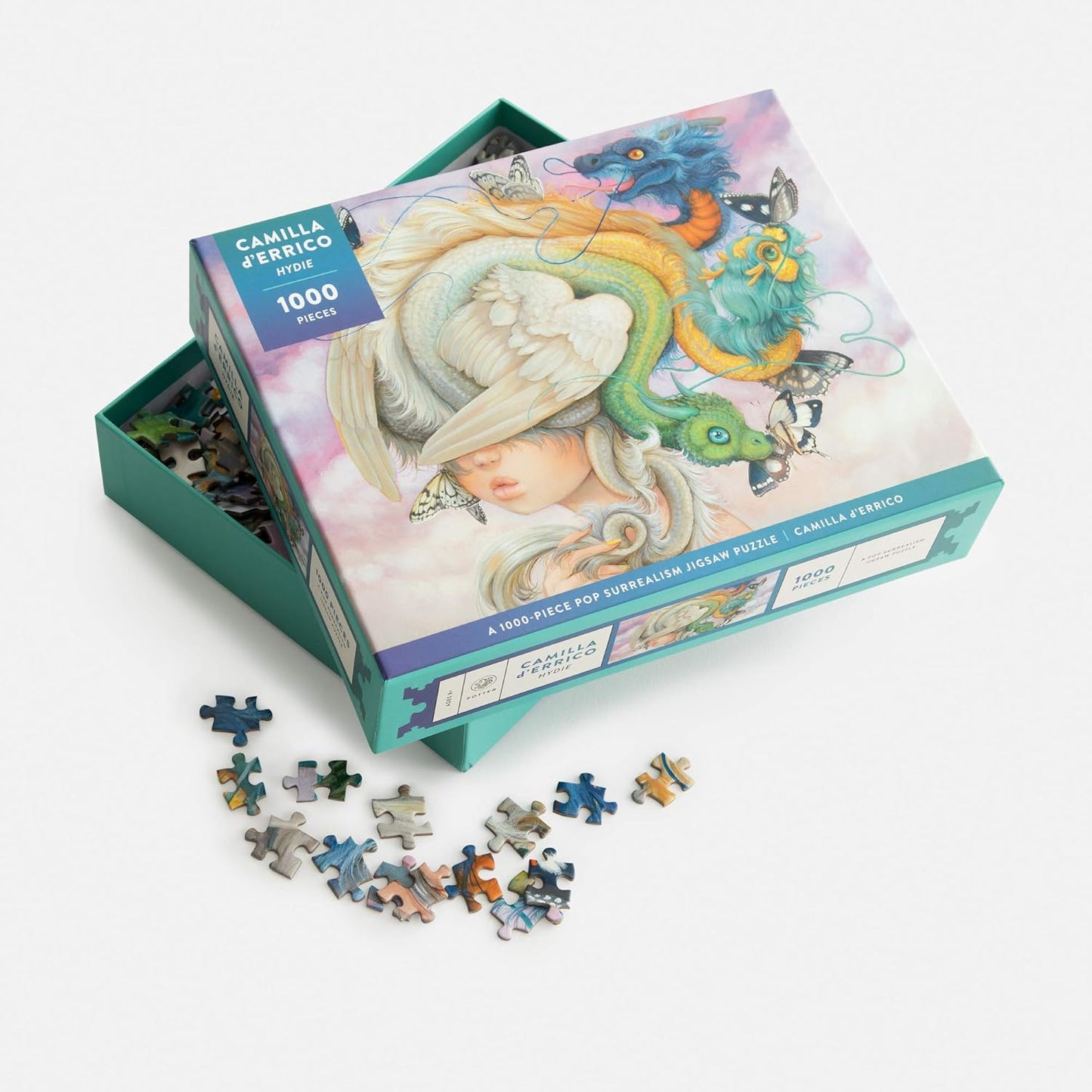 Camilla Ferrero puzzle box with puzzle pieces on a white background