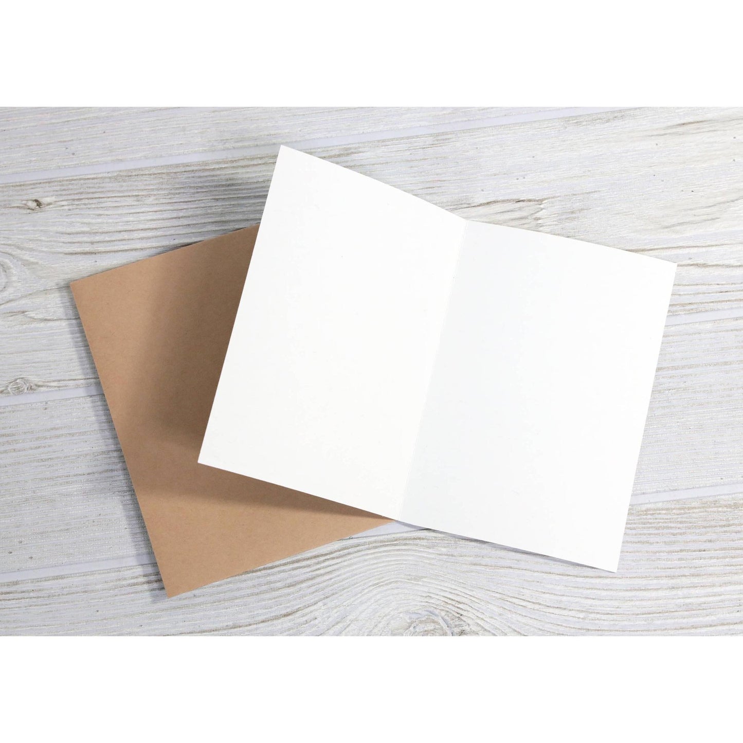 Inside of a blank greeting card with brown envelope