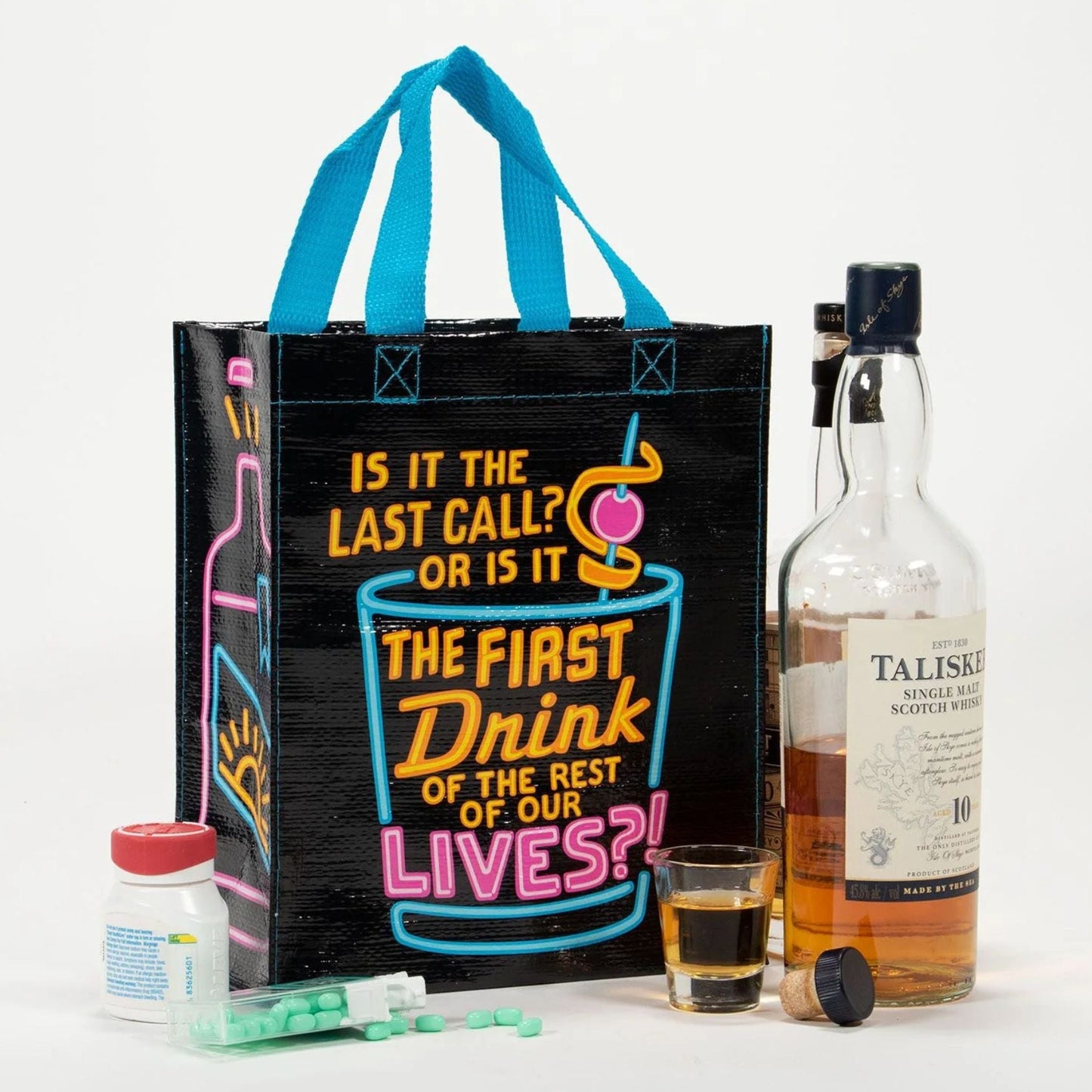 Black tote bag with colorful text and a bottle of Talisker whisky