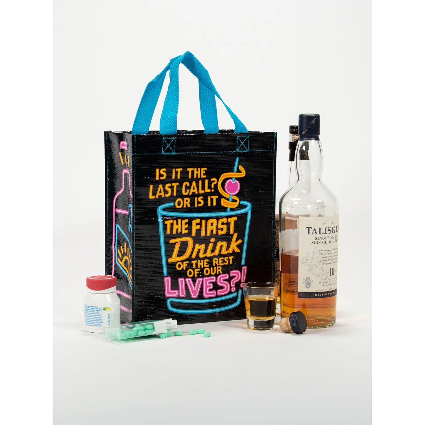 Black tote bag with colorful text and a bottle of Talisker whisky