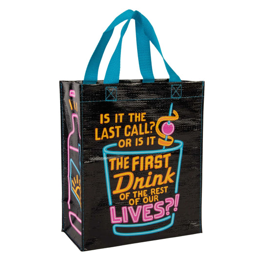 Black tote bag with colorful text and graphics on a white background