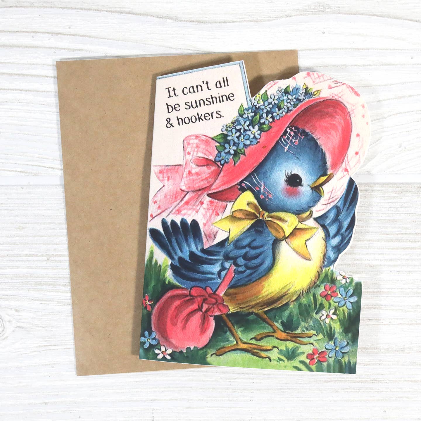 Vintage-style greeting card with a bird wearing a hat and holding a pink handbag, featuring a humorous quote.