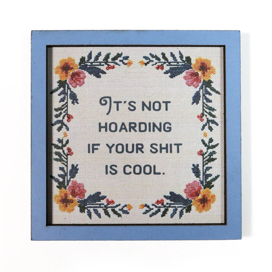 Decorative magnet with floral design and humorous quote "It's not hoarding if your shit is cool".