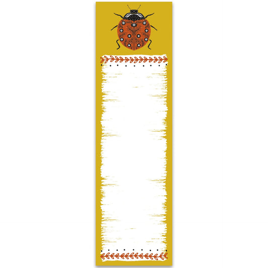 Notepad with a ladybug design on a yellow background