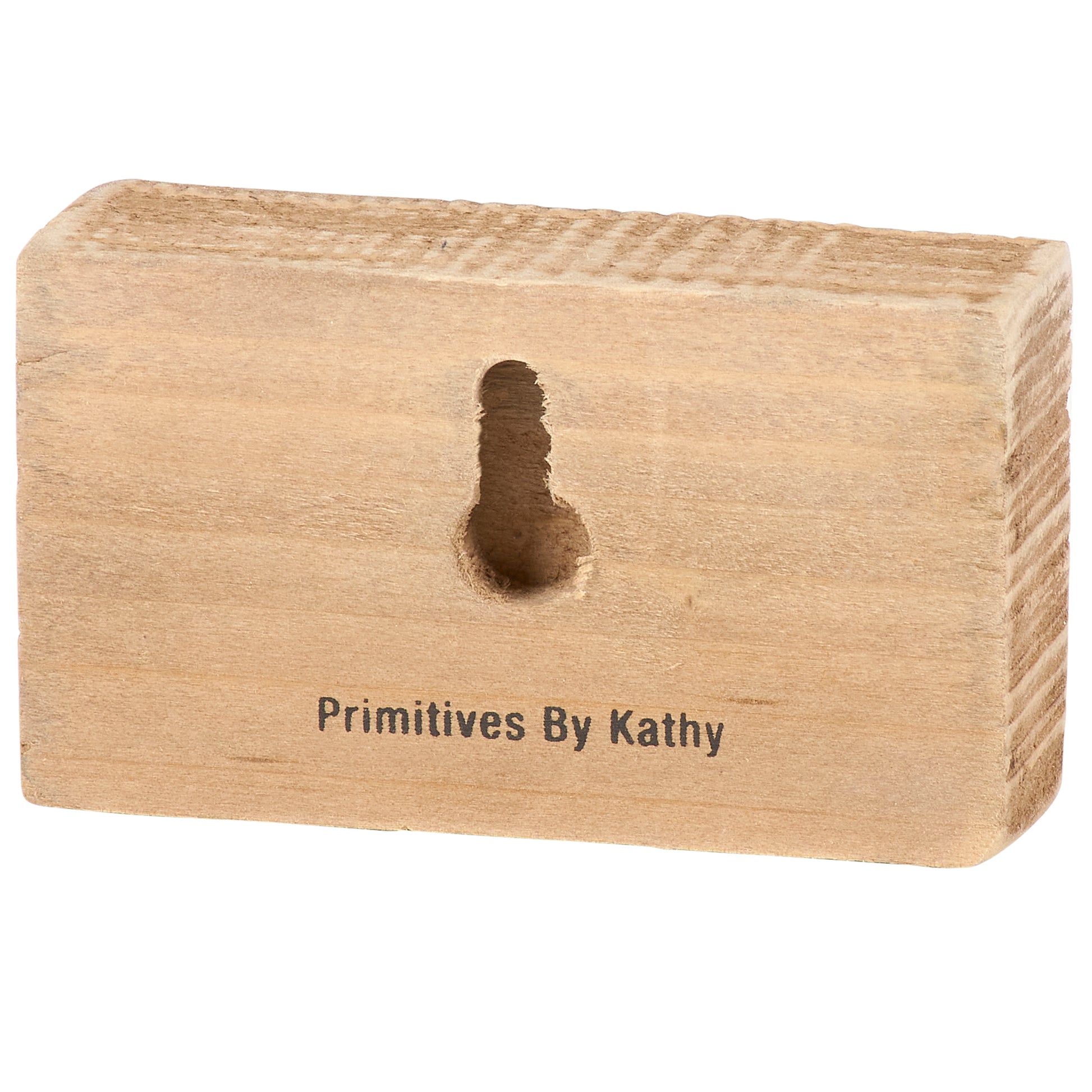 Back of a wooden block with a hole and 'Primitives By Kathy' branding on a white background
