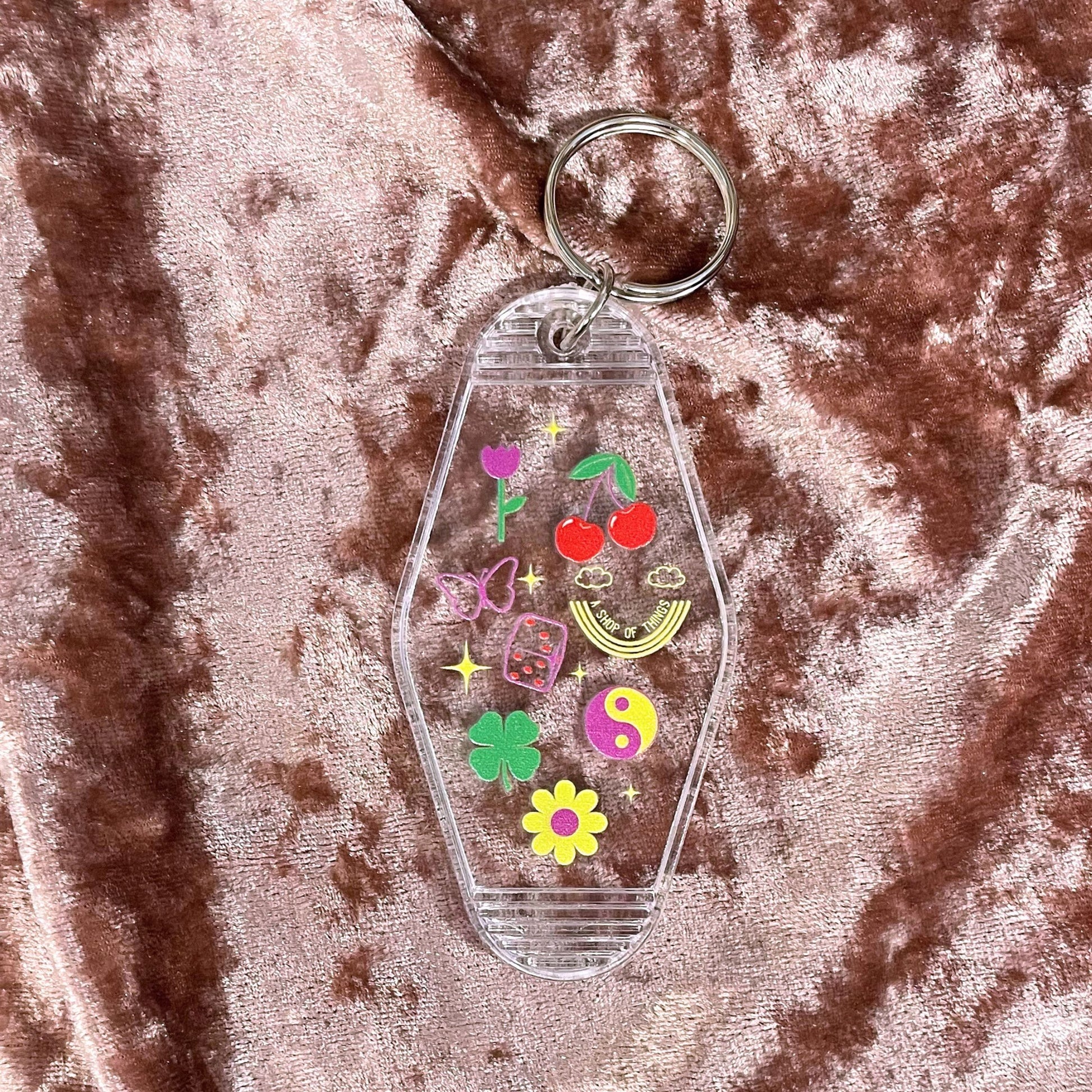 Lucky Charm Motel Keychain in Transparent Clear