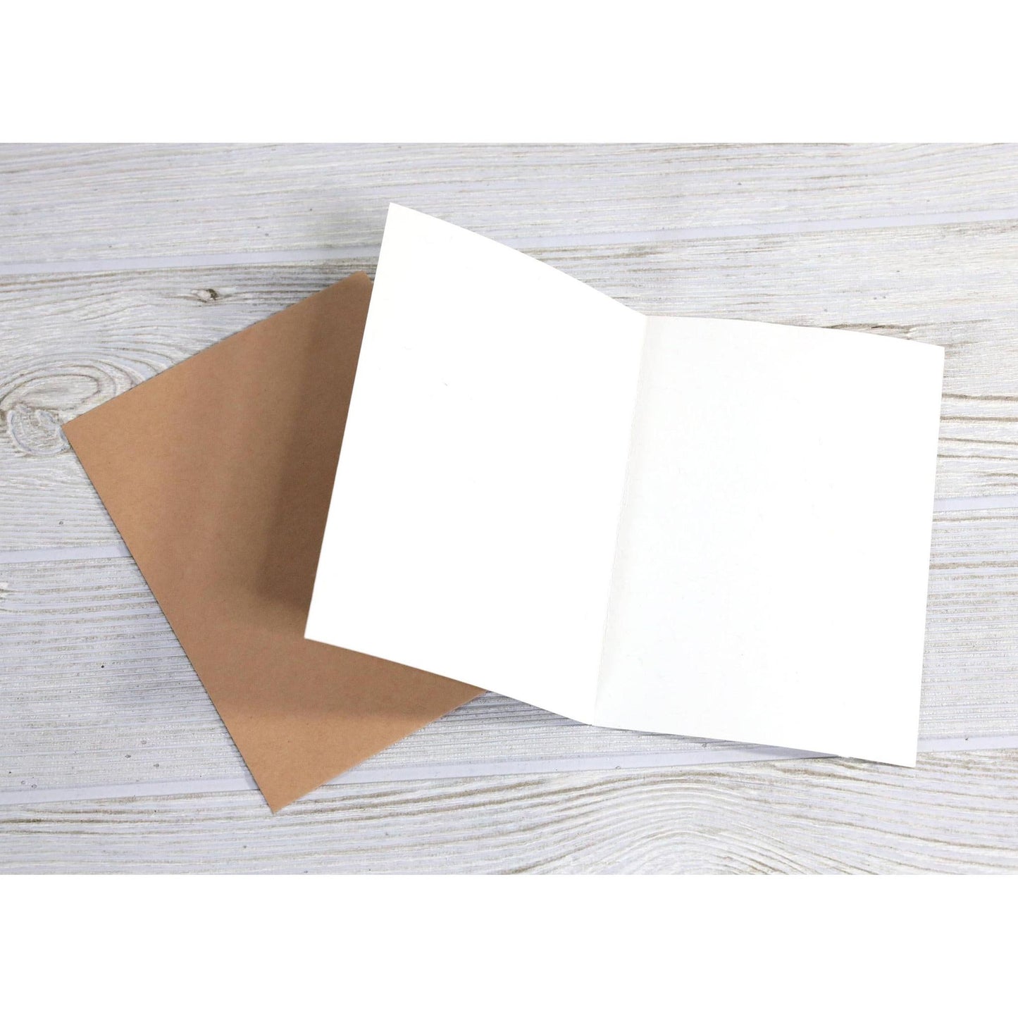 Inside of a blank greeting card with brown envelope