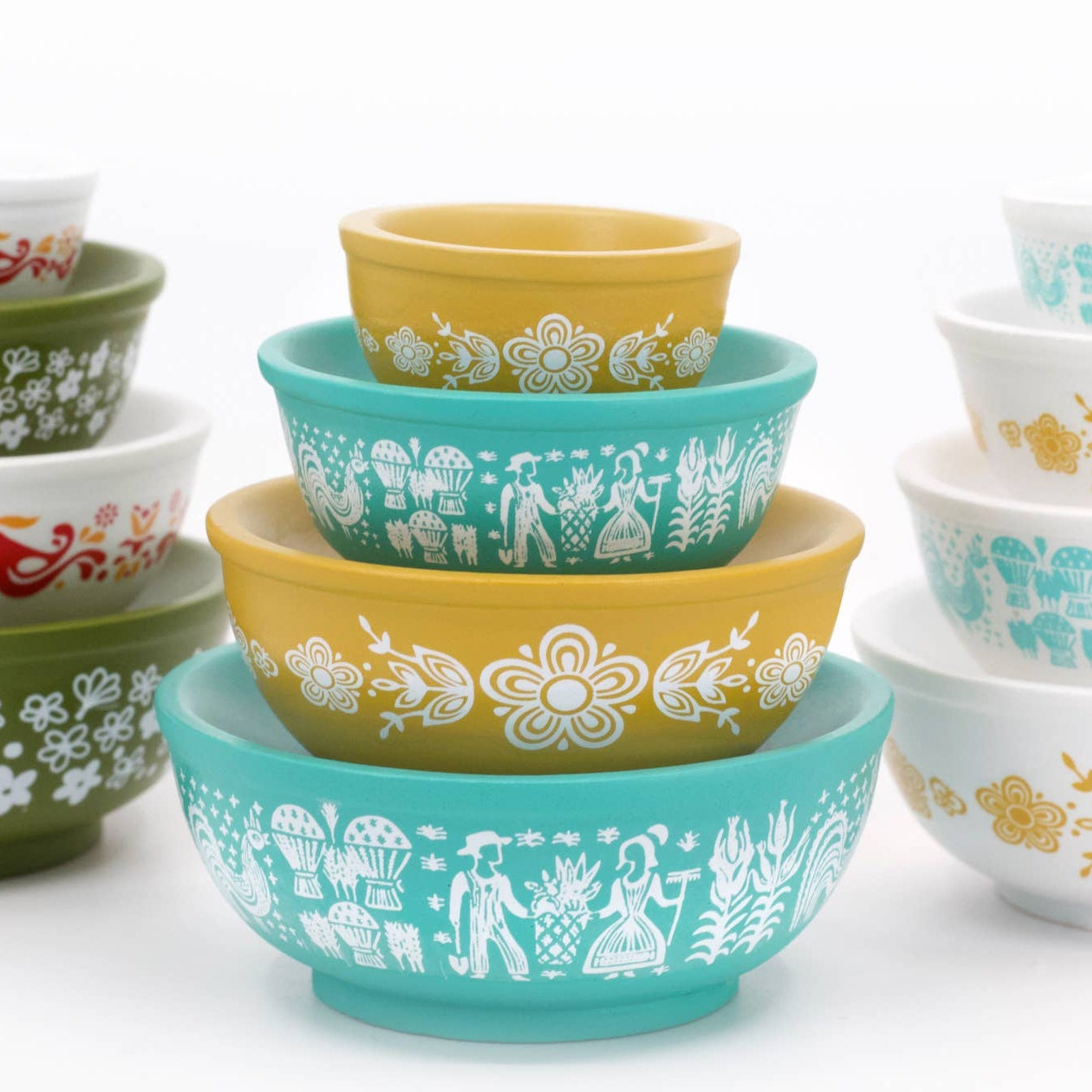Stacked colorful bowls with patterns on a white background