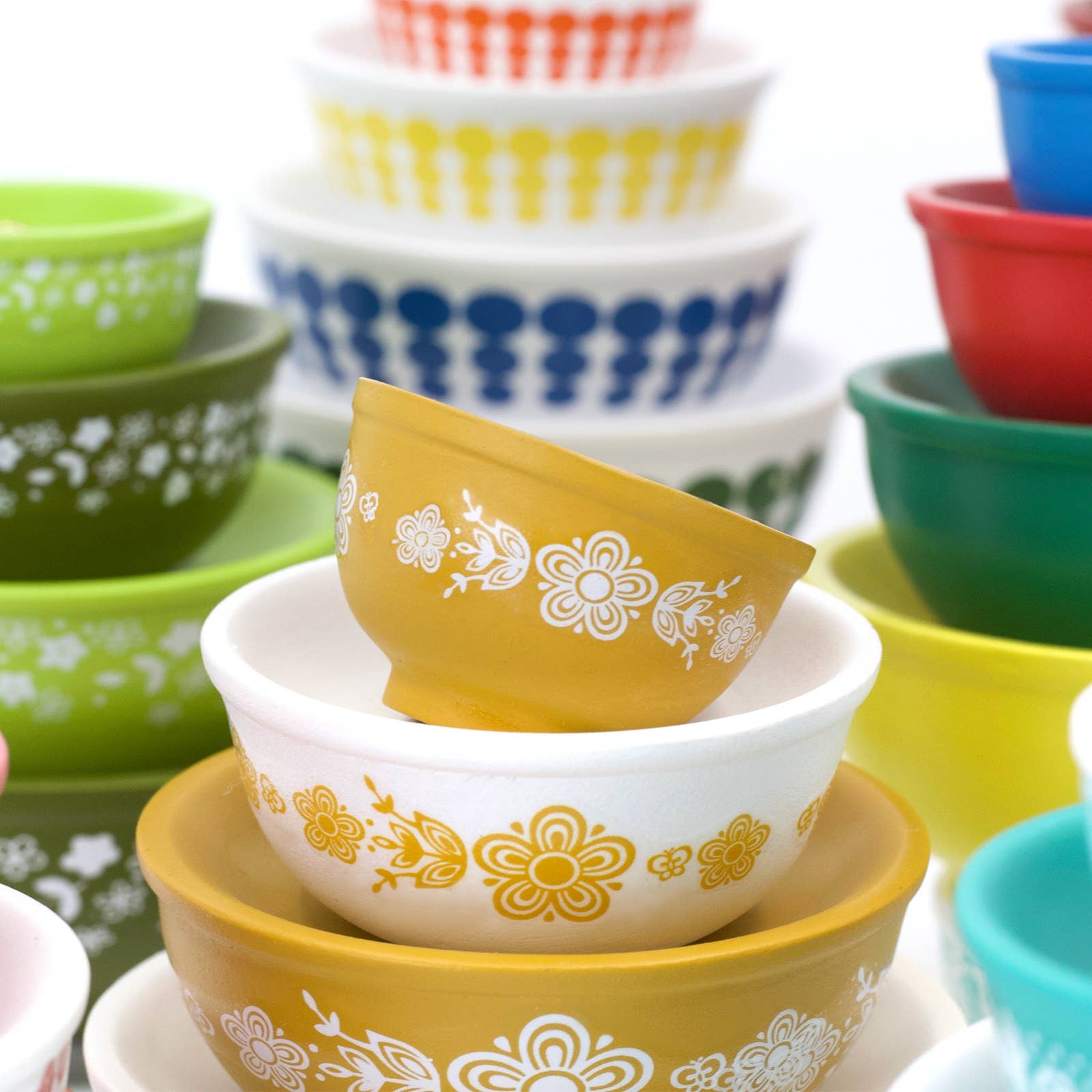 Colorful set of mini ceramic bowls with floral patterns