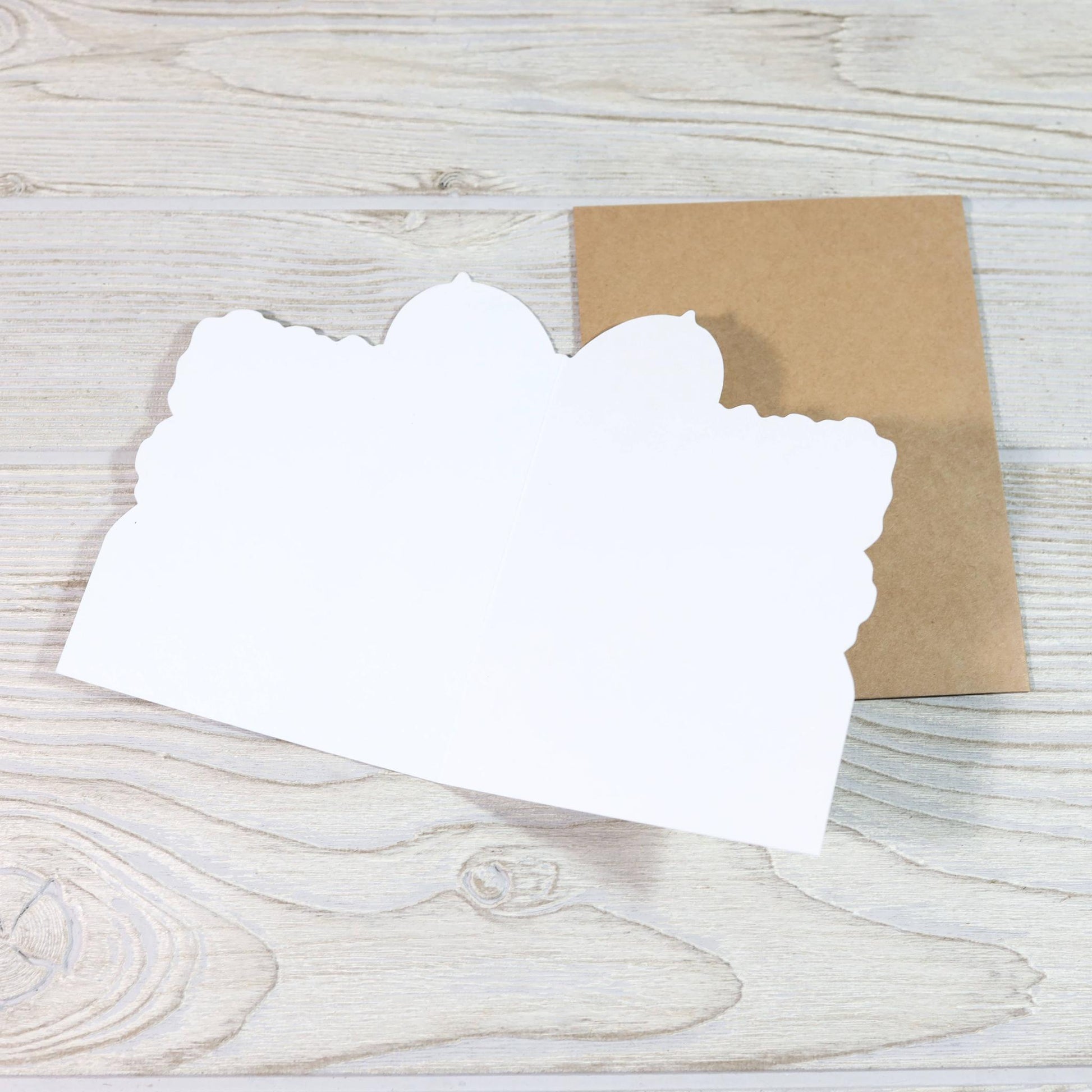 Inside of a blank greeting card with brown envelope