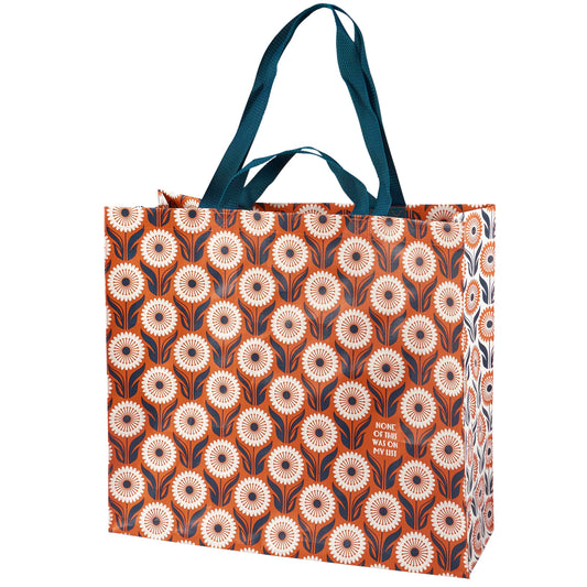 Tote bag with floral pattern and text on a white background