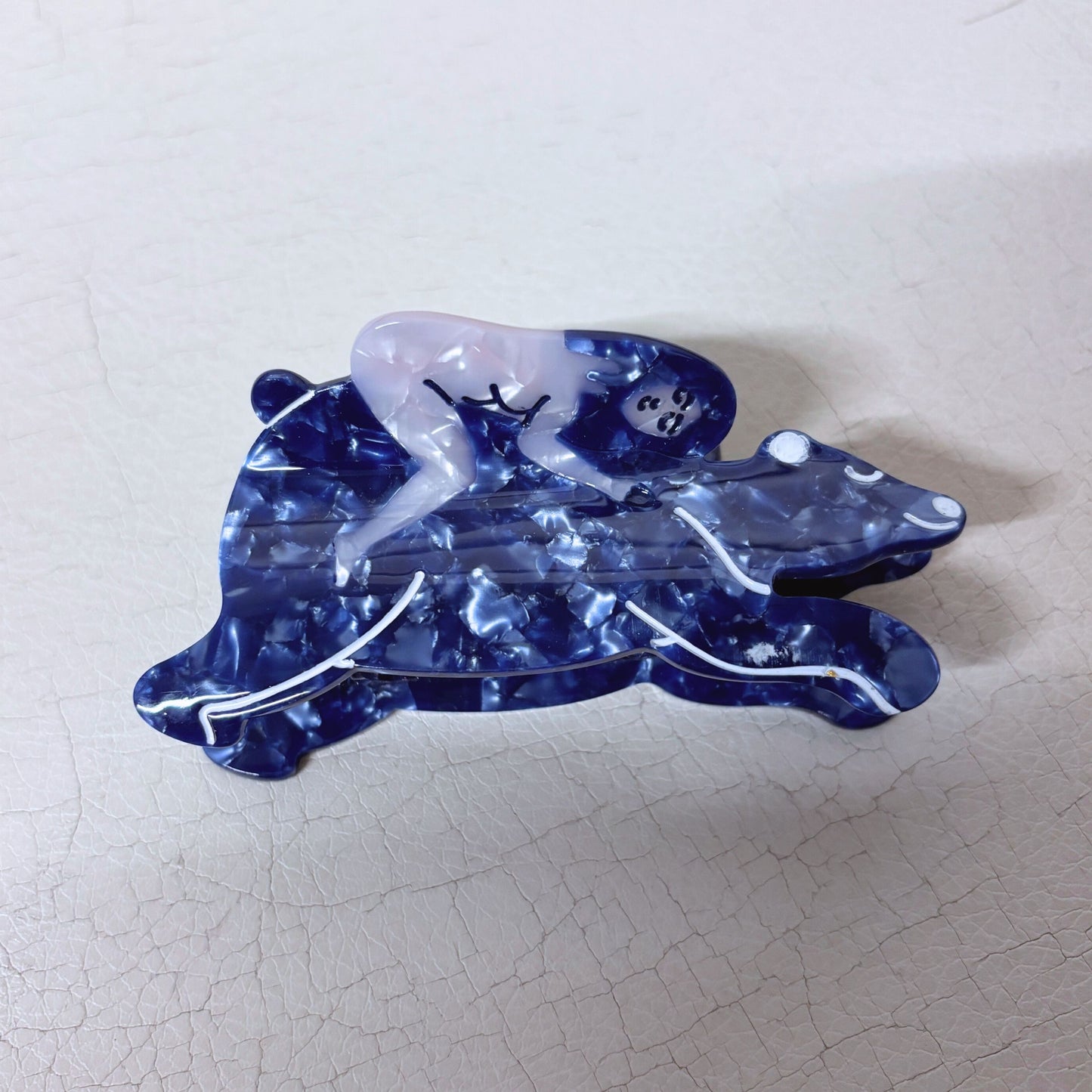 Nude Woman Riding a Bear Hair Claw in Marbled Blue | Claw Clip in Velvet Travel Bag