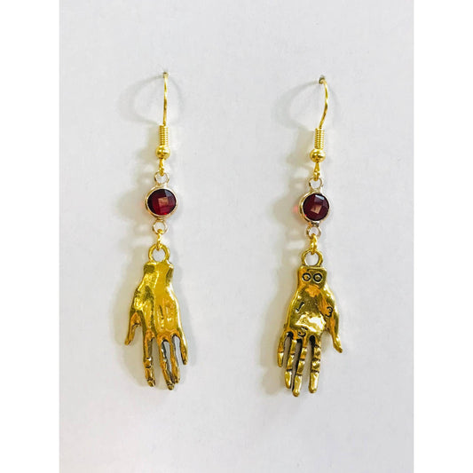 Gold hand-shaped earrings with red gemstones