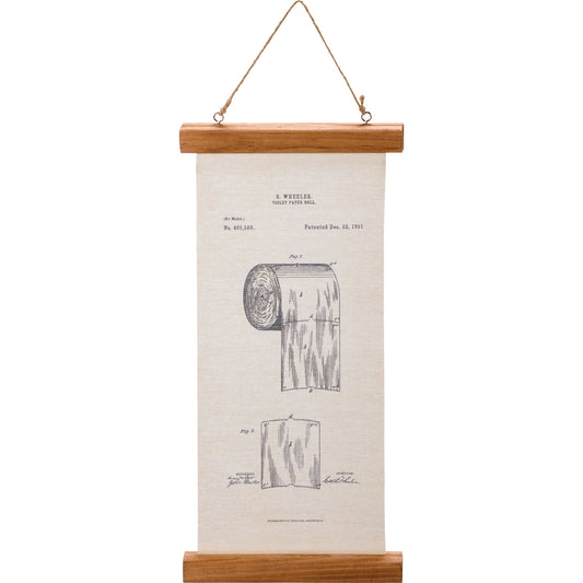 Wall hanging with a wooden frame displaying a toilet paper roll patent illustration on a white background