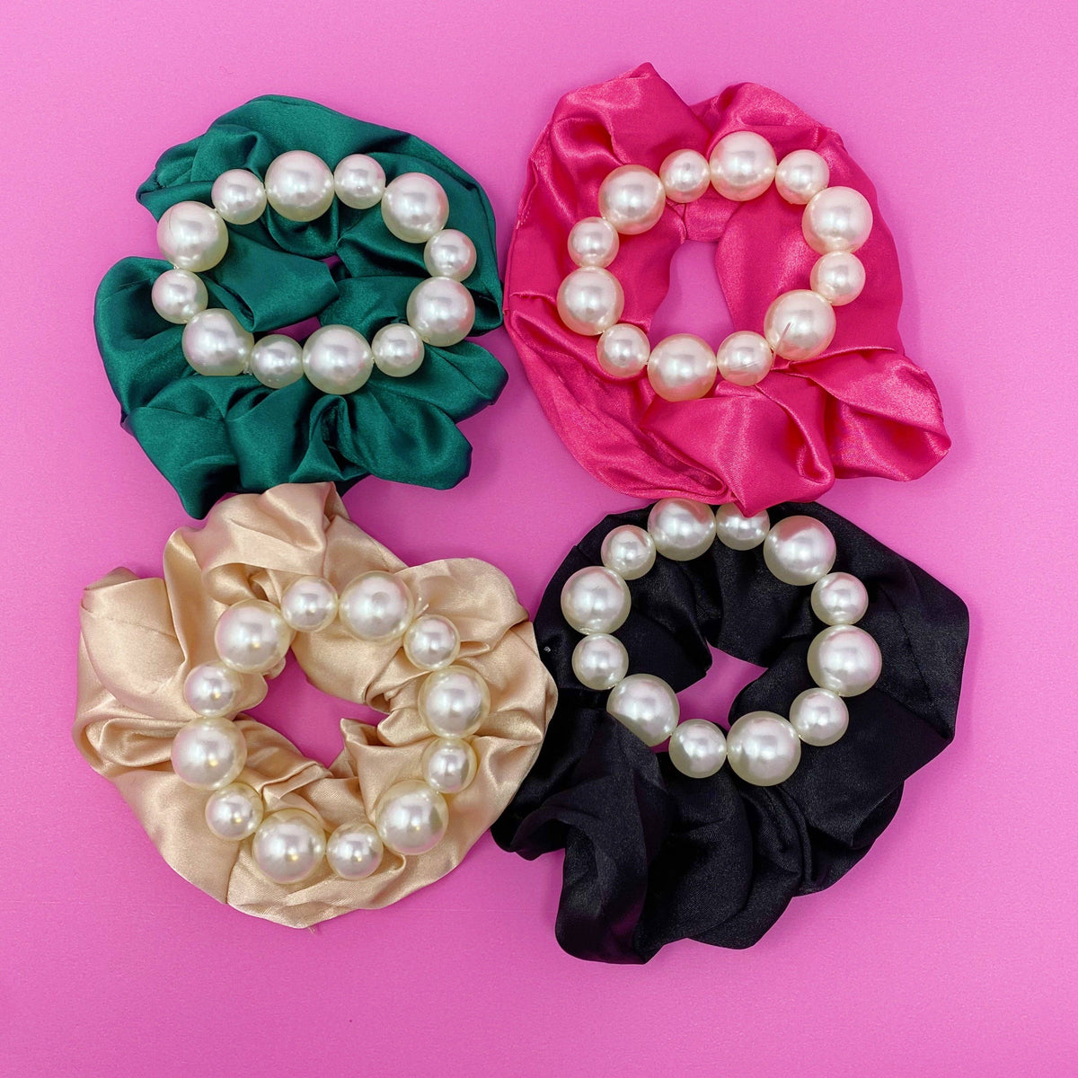 Four scrunchies with pearl embellishments