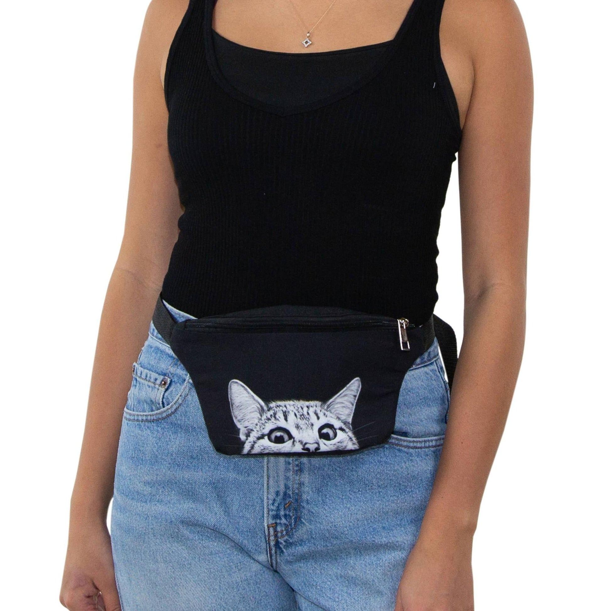 Woman wearing a black tank top and blue jeans with a black fanny pack featuring a cat design.