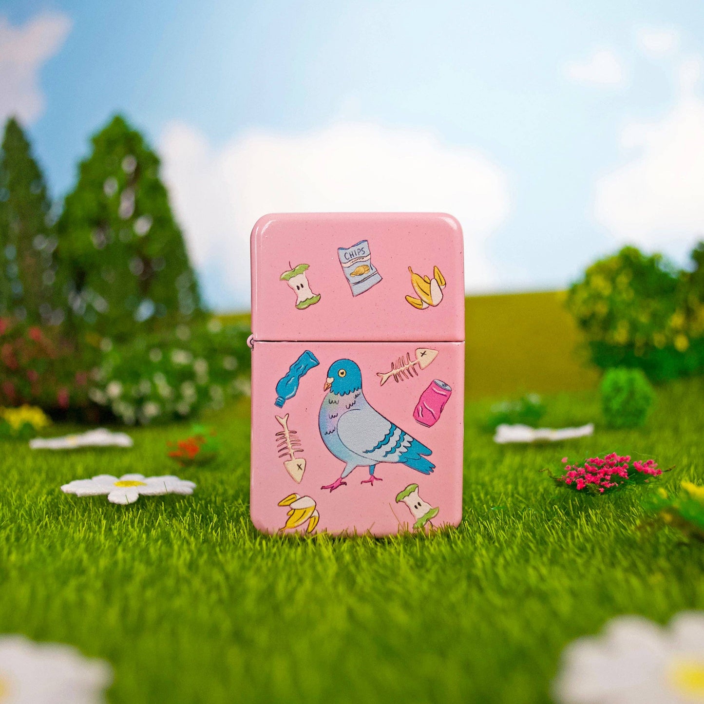 Pink lighter with bird design on grass and flowers