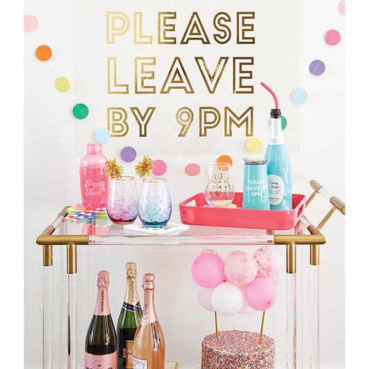 Decorated bar cart with colorful drinks and 'Please Leave by 9 PM' text
