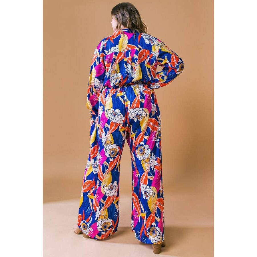 Plus Size Printed Woven Jumpsuit in Blue with Flowers And Leaf Designs | Long Sleeve Romper [Sizes 1X-3X]