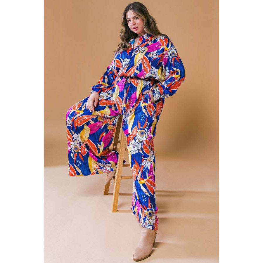 Plus Size Printed Woven Jumpsuit in Blue with Flowers And Leaf Designs | Long Sleeve Romper [Sizes 1X-3X]