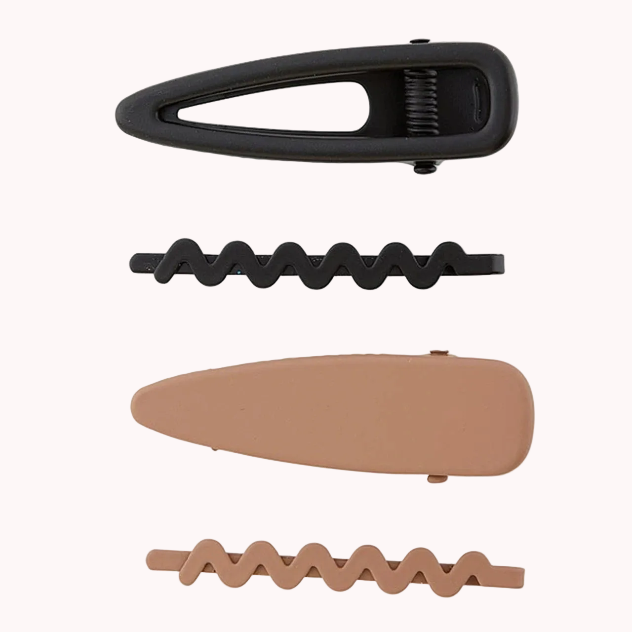 Set of black and brown hair clips on a white background