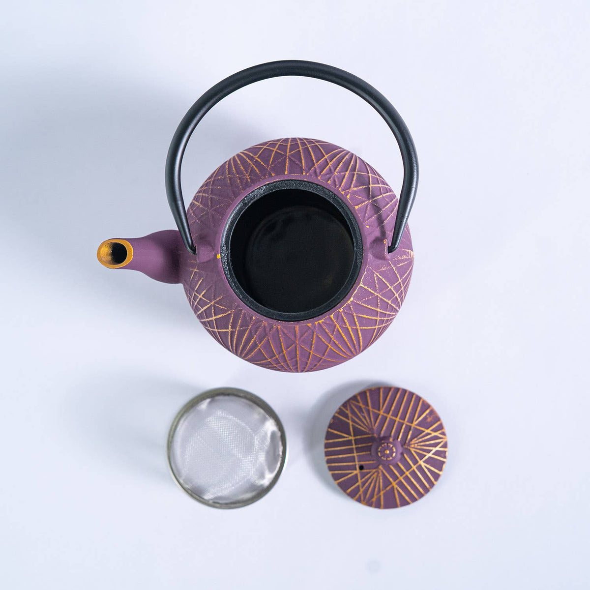 Purple cast iron teapot with geometric design 