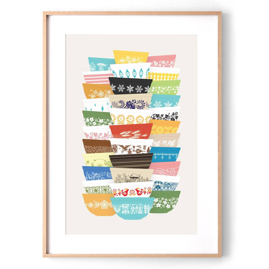Framed artwork of colorful patterned Pyrex-inspired bowls on a white background