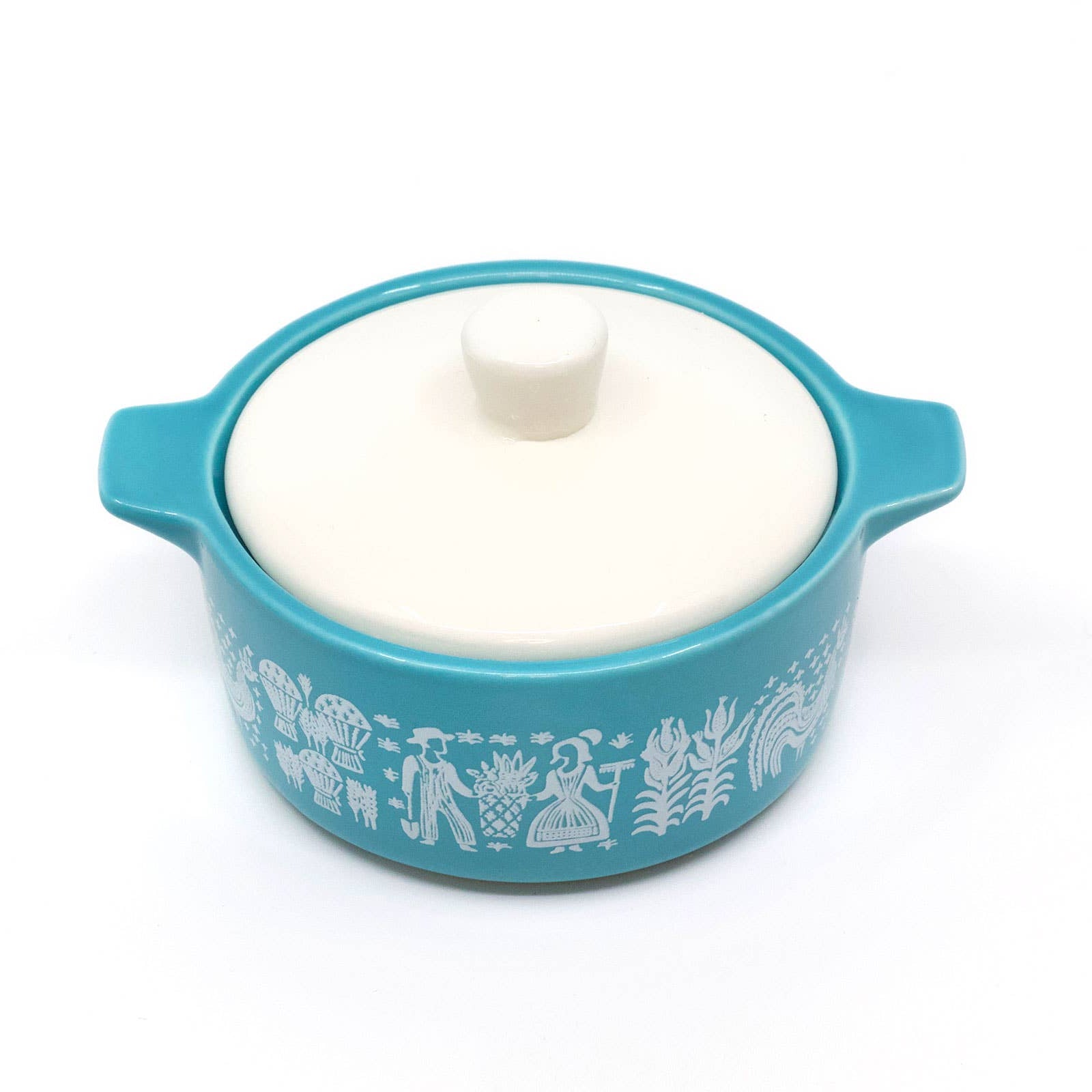 Blue ceramic dish with white lid on a white background